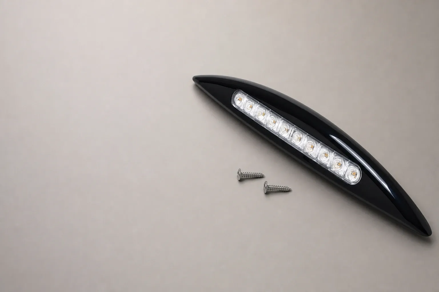 Black LED exterior entrance light unit with integrated LED array and two mounting screws on a neutral background